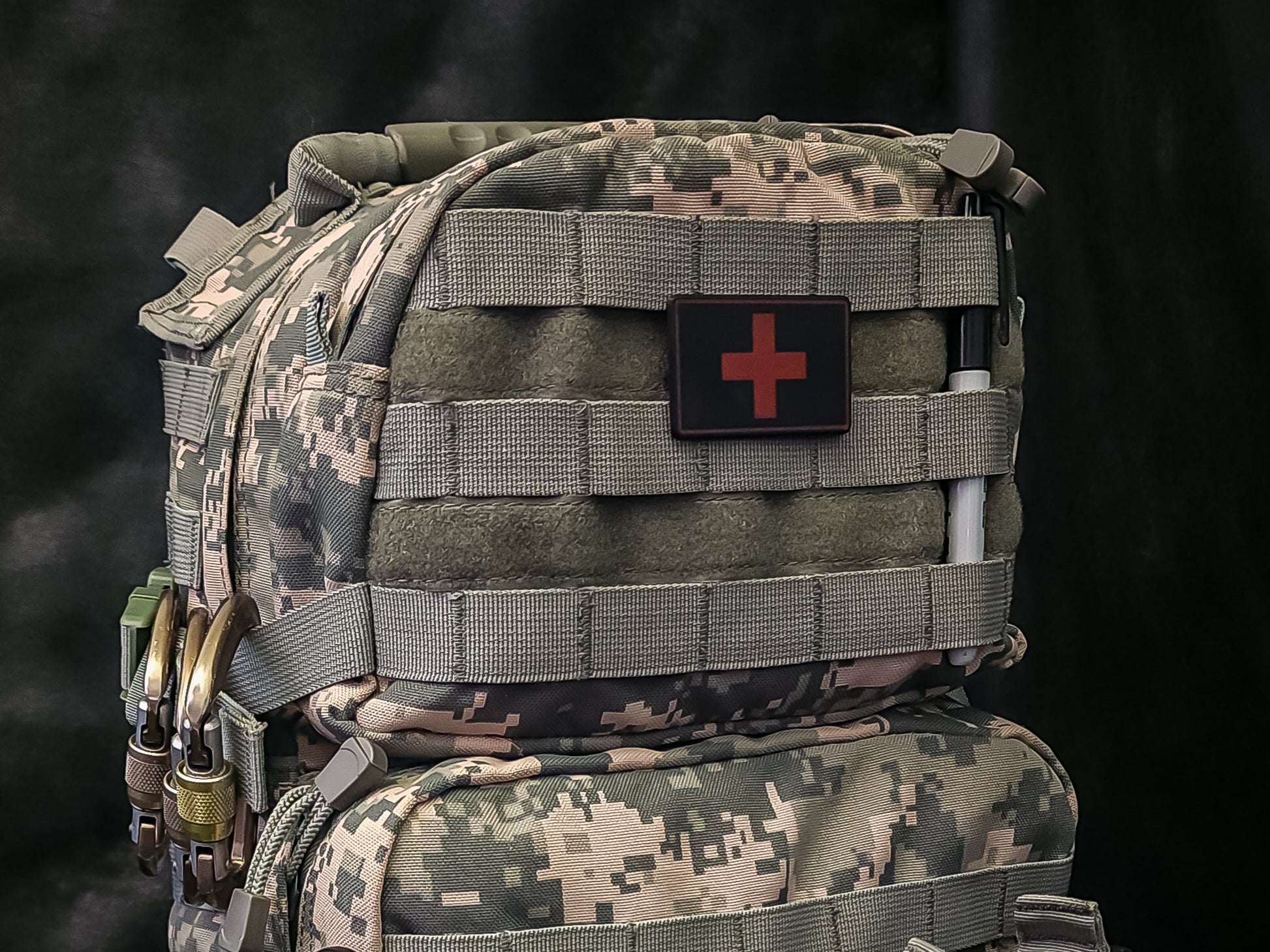MOLLE Medical ID Tags on tactical gear, featuring clear red cross for emergency identification.