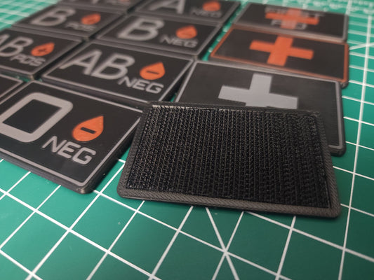 MOLLE Medical ID Tags collection with various blood types displayed on velcro-backed plates.