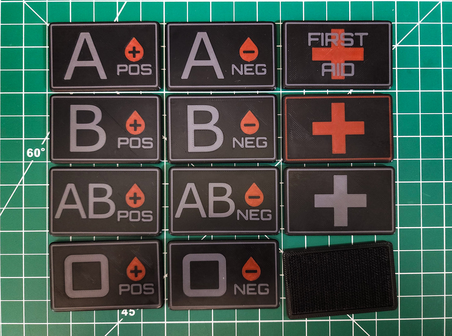 MOLLE Medical ID Tags (Velcro) displaying blood types and first aid symbols.