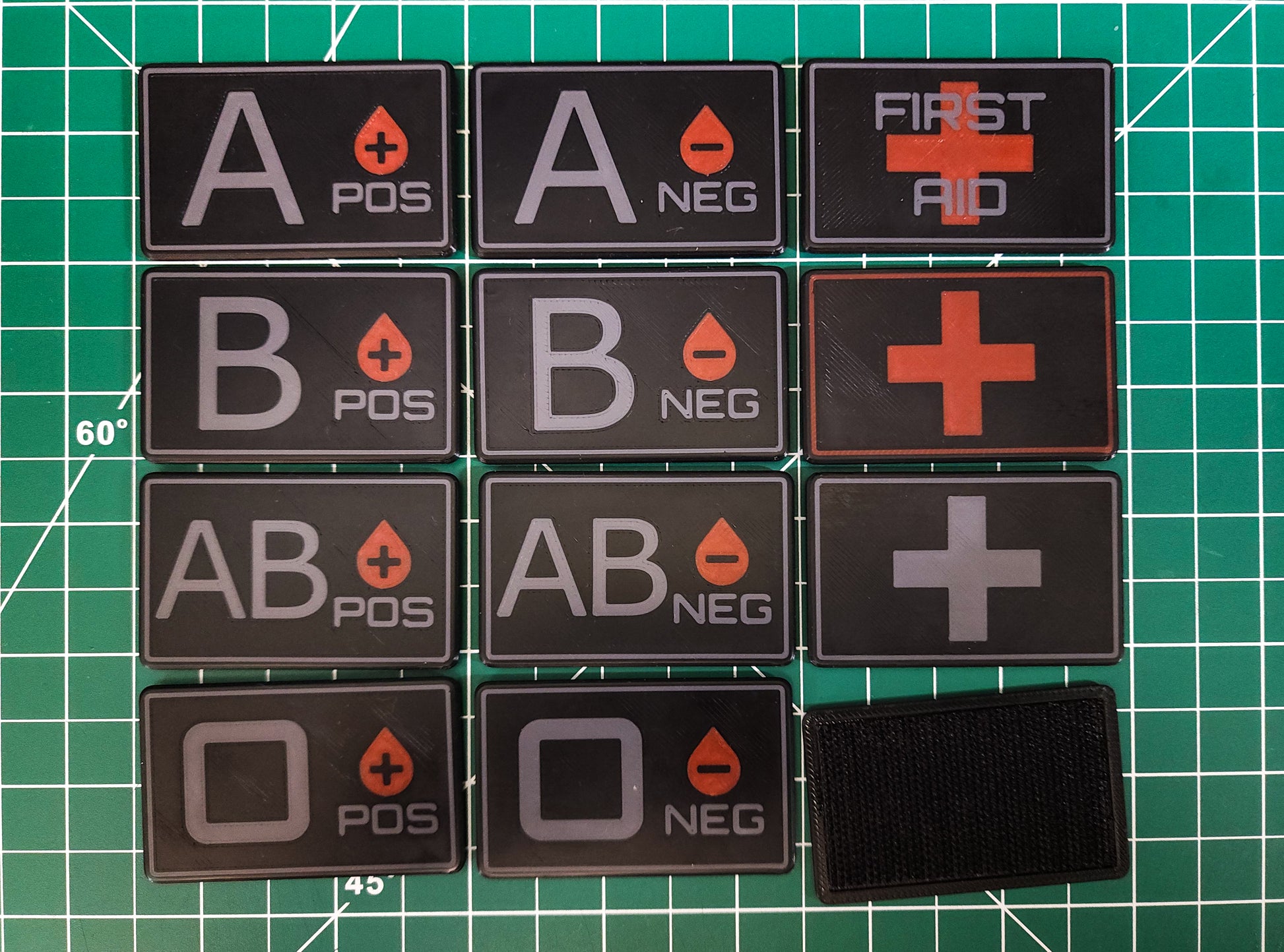 MOLLE Medical ID Tags (Velcro) displaying blood types and first aid symbols.